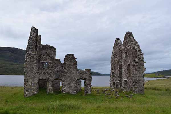 crumbling stone ruins of Calda House, an 18th-century mansion situated on the shore of Loch Assynt in Sutherland,